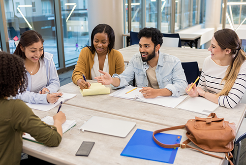 Group of people working around a table