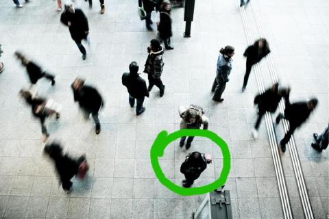 Person circled in a crowd
