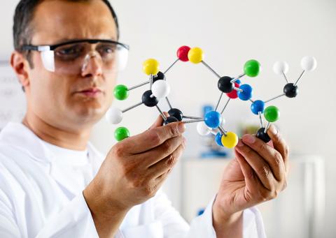 Man with molecular model
