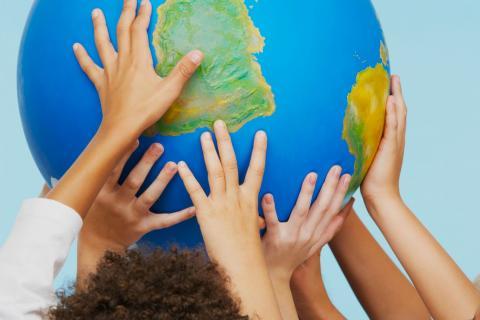 Hands on globe